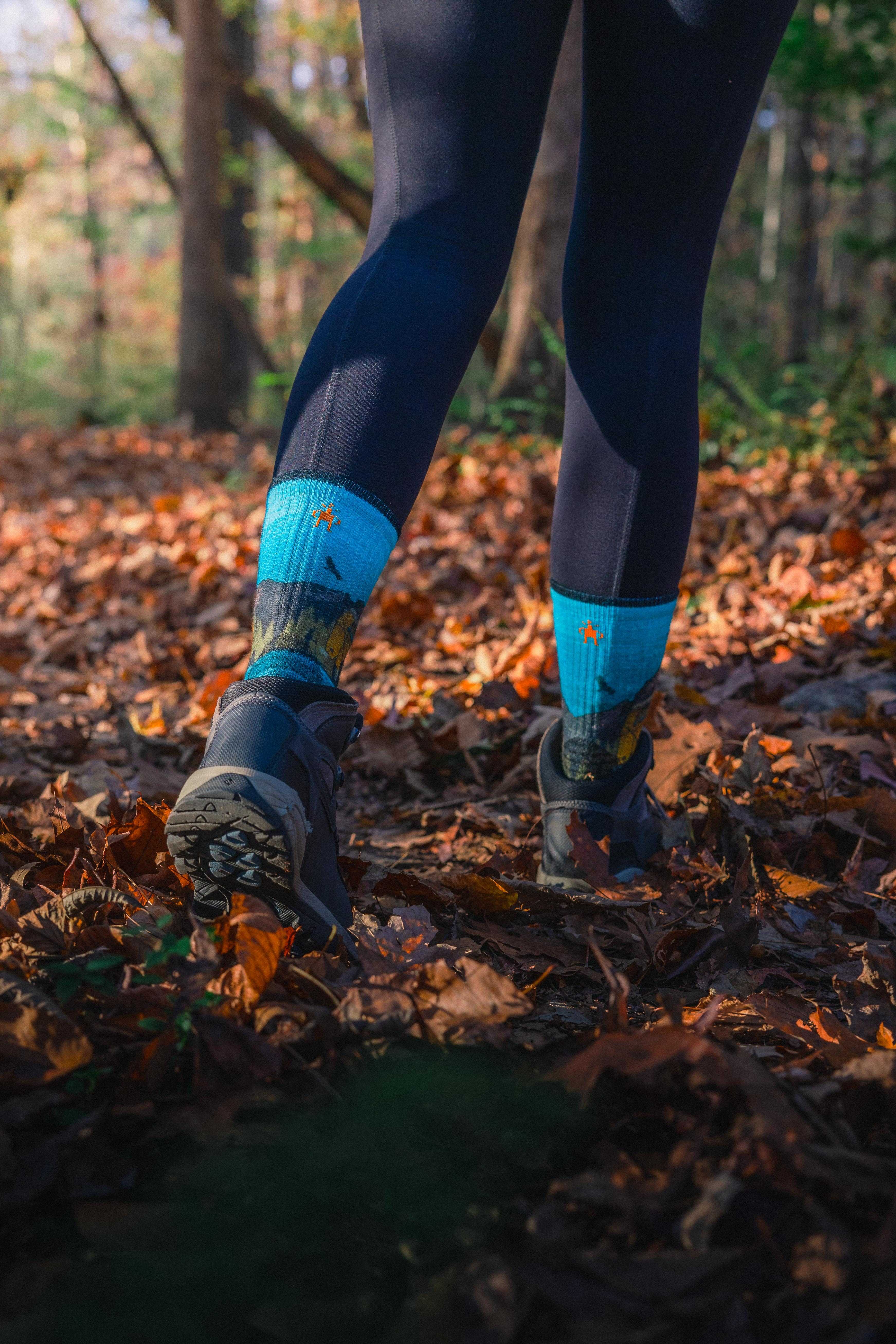 lifestyle woman hiking with smartwool socks.jpg